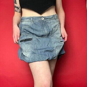 Grungy above the knee cargo denim skirt with pockets all over​​​​​​​​​​​​
